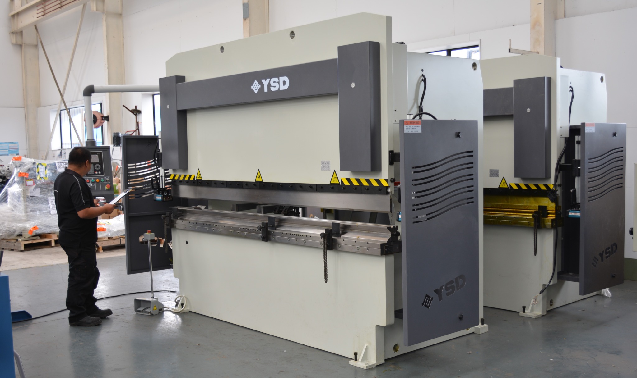 Scott Machinery technician checking machinery before handover